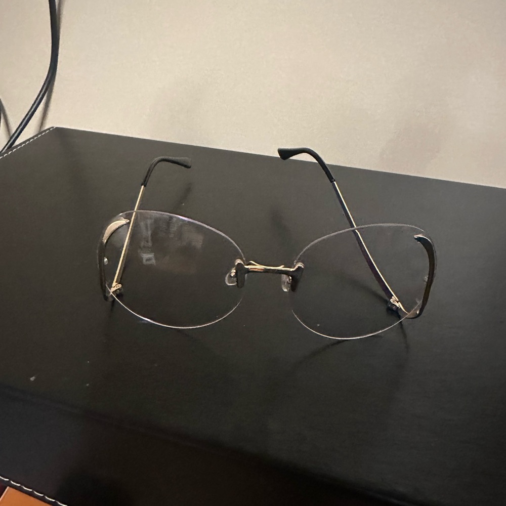 Gold and Black Rimless Glasses